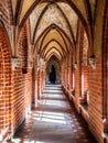 Ornamental brick corridor of Teutonic Malbork Caste, Poland Royalty Free Stock Photo