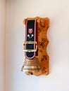 Ornamental cowbell hanging on the wall