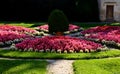 Ornamental flower bed in front of the castle on the ground floor. Planting annuals has the shape of a circle or strips bordered by Royalty Free Stock Photo