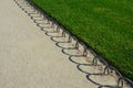 Ornamental flower bed in front of the castle on the ground floor. Planting annuals has the shape of a circle or strips bordered by Royalty Free Stock Photo