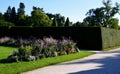 Ornamental flower bed in front of the castle on the ground floor. Planting annuals has the shape of a circle or strips bordered by Royalty Free Stock Photo