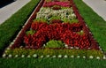 Ornamental flower bed in front of the castle on the ground floor. Planting annuals has the shape of a circle or strips bordered by Royalty Free Stock Photo