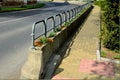 Ornamental flower pots next to the road to the square. ornamental perennial flowers grass. block shape flower pot made of wood mat Royalty Free Stock Photo