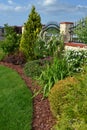 Ornamental garden with group of colourfull shrubs perennials and conifers Royalty Free Stock Photo