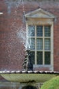 Ornamental garden water fountain. Classical water feature. Royalty Free Stock Photo