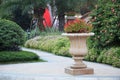 Ornamental stone flowerpot in garden