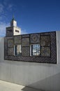 Ornamental windows on roof top terrace with mosque tower in Tunisia Royalty Free Stock Photo