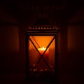 Ornamental wooden lantern with burning candle