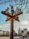 Ornamental wooden signpost with the directions to Mechelen`s main tourist landmarks, Belgium