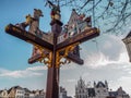 Ornamental wooden signpost with the directions to Mechelen`s main tourist landmarks, Belgium