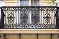 an ornamental wrought ironwork of a classic balcony