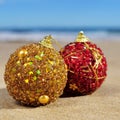 Ornamented christmas balls on the beach Royalty Free Stock Photo