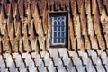 Ornamented wooden wall of the Ringebu Stave Church with a square window in Norway Royalty Free Stock Photo