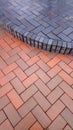 Pavement tiles - combined orange and brown klinker tiles Royalty Free Stock Photo