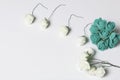 Ornaments for celebrations. A bouquet of artificial flowers. Rose beige and emerald colors. On a white background.