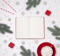Ornaments, fir branches, cup of hot chocolate with marshmallow and red gift boxes on a white background Royalty Free Stock Photo