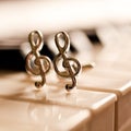 Ornaments in the form of a treble clef on piano keyboard