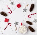 Ornaments, pine cones, cup of hot chocolate with marshmallow and red gift boxes on a white background Royalty Free Stock Photo