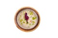 Ornate and appetizing fish soup on a white background.