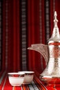 Ornate arabian tea cups and a dallah tea pot Royalty Free Stock Photo