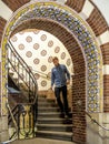 Ornate arch opening to a spiral stairwell