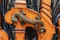 Ornate art nouveau wooden door detail with organic motif and a bronze figurine of a lizard shaped door handle in Paris, France Royalty Free Stock Photo