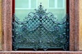 Ornate and artistic old wrough iron window balustrade and grill