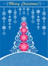 Ornate blue Christmas craft greeting card with white paper cut out hanging decoration with snowflakes, decorative xmas tree and la Royalty Free Stock Photo