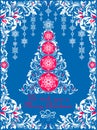 Ornate craft blue Christmas greeting card with white floral paper cut out border,  hanging decoration, snowflakes and decorative x Royalty Free Stock Photo