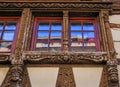 Ornate carved wooden window on a half timbered house, Strasbourg, Alsace, France