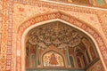 Ornate carvings on the exterior arch and entrance walls of the Historic Amber palace in the city of Jaipur in Rajasthan, India