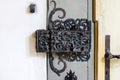 Ornate cast iron lock on an old wooden door Royalty Free Stock Photo