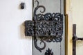 Ornate cast iron lock on an old wooden door Royalty Free Stock Photo