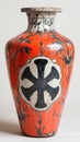 Vintage Orange Vase with Black Bamboo and Emblem Royalty Free Stock Photo