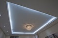 Ornate chandelier style ceiling light inside luxury apartment