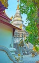 The chedi of Wat Phan Waen behind the Naga serpent sculpture, Chiang Mai, Thailand