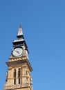 clock tower of the historic 19th century atkinson building in southport merseyside against a blue summer sky