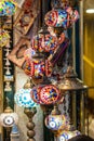 ornate colorful lamps hanging in a store window of a traditional turkish market