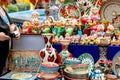 Ornate colorful oriental dishes and ceramics on market window. Silk Road