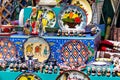 Ornate colorful oriental dishes and ceramics on market window. Silk Road