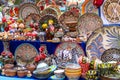 Ornate colorful oriental dishes and ceramics on market window. Silk Road