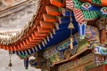 Colorful roof construction with wind chimes on a temple in Kumbum Jampaling Monastery, Xining, China Royalty Free Stock Photo