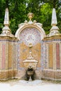 Ornate, colorful water fountain with in a lush forest setting in Sintra, Portugal Royalty Free Stock Photo