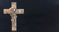 Ornate cross with a flower on a dark background. Condolence card. Empty place for emotional sentimental quote. Royalty Free Stock Photo