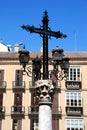 Ornate cross with lamps in the Plaza de la Aduana in the city centre, Malaga, Spain.