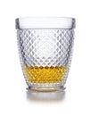 An ornate  crystal glass containing scotch whisky shot on white, with a slight drop shadow Royalty Free Stock Photo