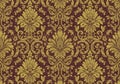 Ornate damask pattern featuring intricate floral and foliate designs in gold on a deep Royalty Free Stock Photo