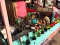 Colorful Elixirs on a Wooden Cart With Shrine