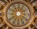 Ornate dome ceiling with gold trim and painted panels viewed from below Royalty Free Stock Photo