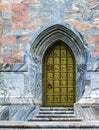 Ornate door metal with surrounding marble wall of Bok Tower.